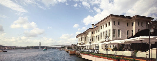 view of the historic Hotel Les Ottomans mansion and its luxury waterfront terraces on the Bosphorus in Istanbul.