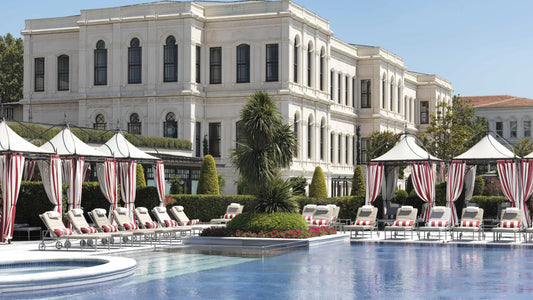 The expansive marble terrace and historic palace facade of Four Seasons Bosphorus, highlighting the luxury waterfront lifestyle in Istanbul.