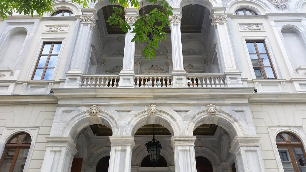 Intricate 19th-century ceiling frescoes and original marble stairs inside the historic Palazzo Corpi, now Soho House Istanbul, showcasing heritage engineering.