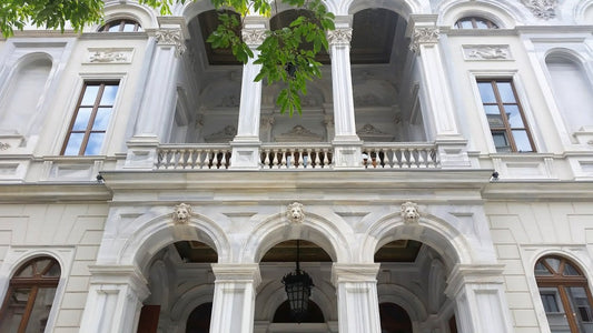 Intricate 19th-century ceiling frescoes and original marble stairs inside the historic Palazzo Corpi, now Soho House Istanbul, showcasing heritage engineering.