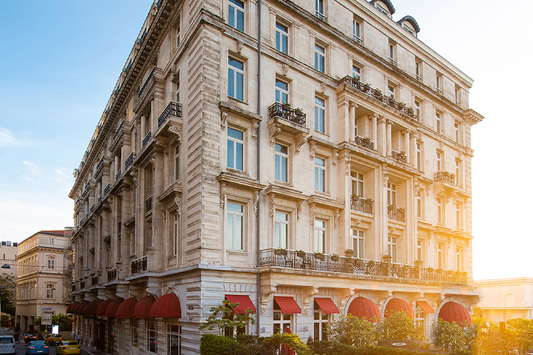 Neoclassical exterior architecture of the historic Pera Palace Hotel in Istanbul's Beyoğlu district, the ultimate luxury destination for 19th-century Orient Express travelers.