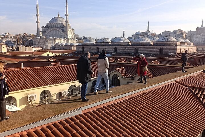 the Mercan district of the Grand Bazaar, Istanbul, with distant views of city domes and the Bosphorus, perfect for a professional photography portfolio.