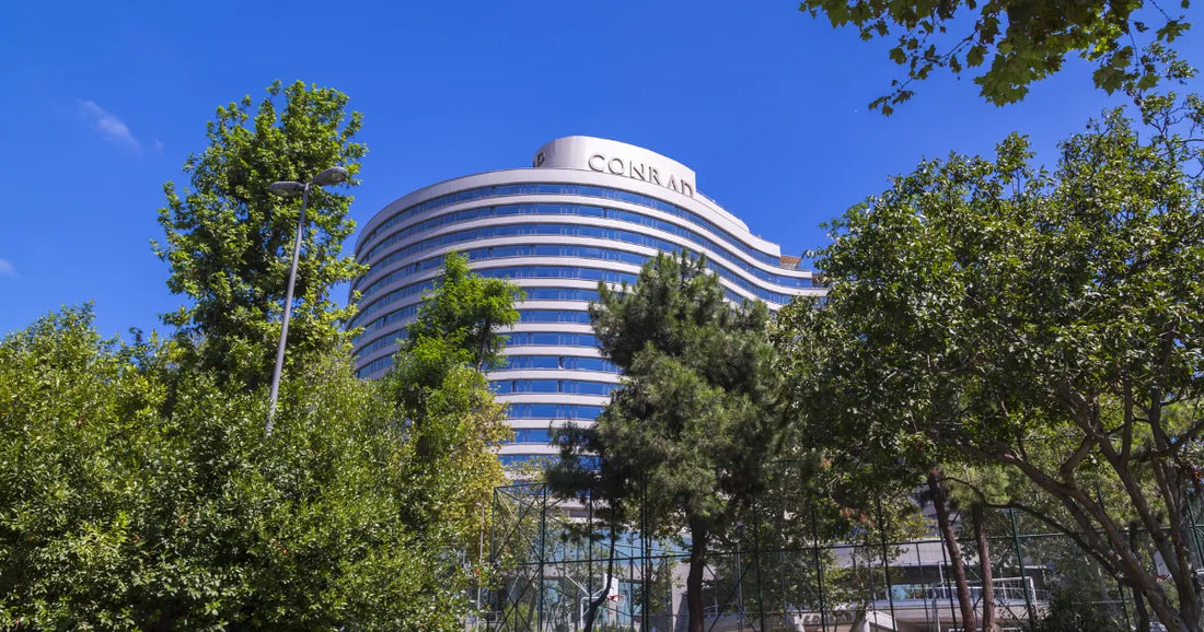 The distinctive curved architectural engineering of the Conrad Istanbul Bosphorus facade, designed to maximize panoramic views over the Beşiktaş district.